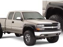Black Extendafender Style Smooth Finish 4-Piece Fender Flare Set With Extended Coverage For 99-07 Silverado/Sierra Trucks (Check Application Guide) Bushwacker