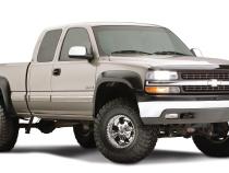 Black Extendafender Style Smooth Finish 4-Piece Fender Flare Set With Extended Coverage For 99-07 Silverado/Sierra Trucks (Check Application Guide) Bushwacker